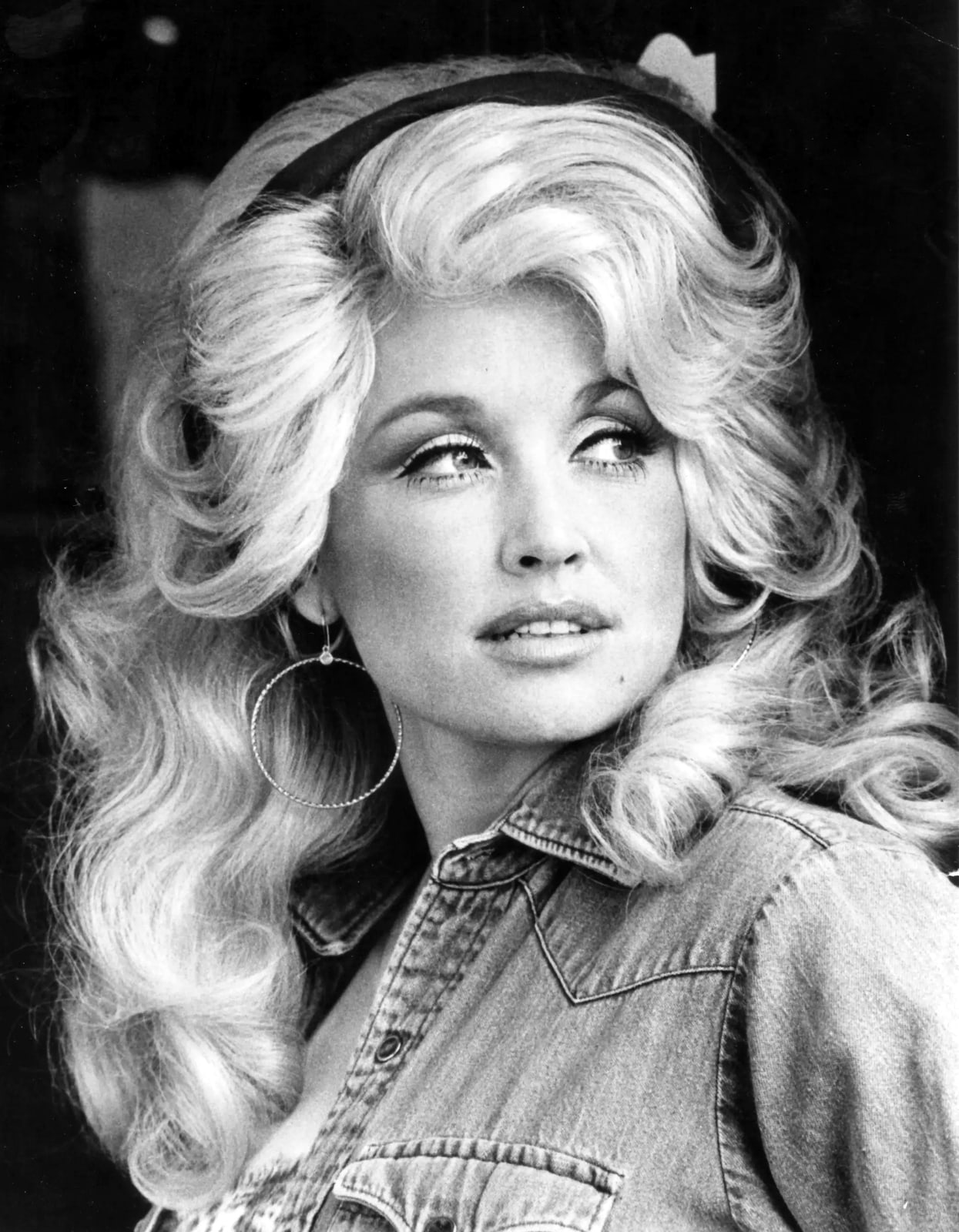 Dolly Parton in a black-and-white publicity portrait