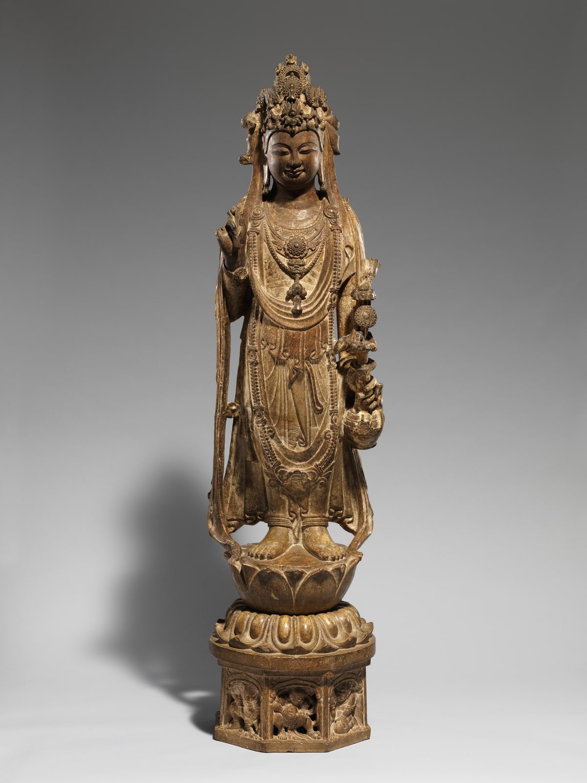 A Chinese limestone sculpture of the bodhisattva Avalokiteshvara with traces of its original painted surface
