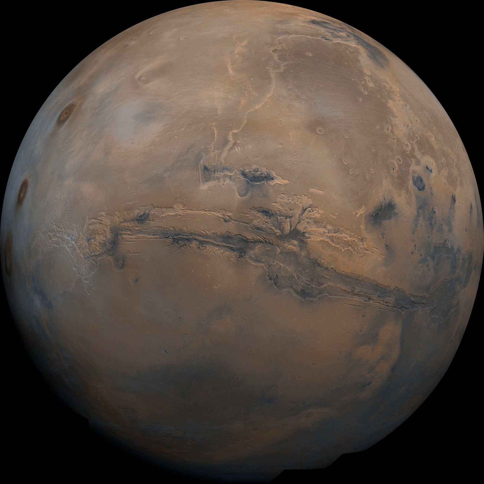 A globe of Mars with the long Valles Marineris canyon visible across its surface